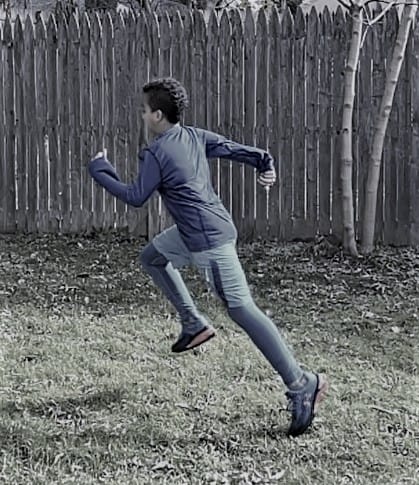 body in motion, an adolescent mid-running stride